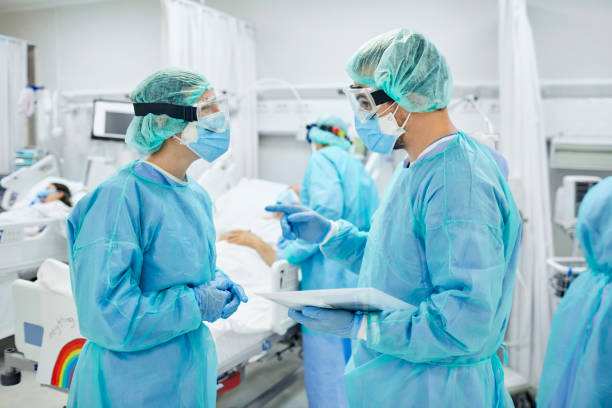 istock Doctors discussing in ward during COVID-19 1307721175