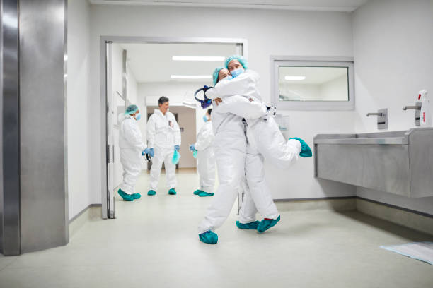 istock Doctors embracing each other during COVID-19 1307721188