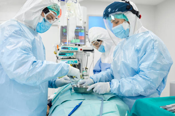 istock Surgeons operating on patient during COVID-19 1307721785