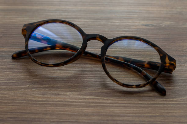 istock Eye Glasses on the wooden office table 1307722290