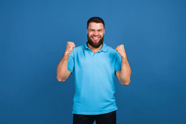 istock Caucasian man's portrait isolated on blue studio background with copyspace 1307723046