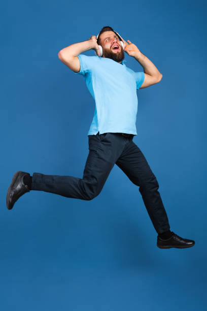 istock Caucasian man's portrait isolated on blue studio background with copyspace 1307723047