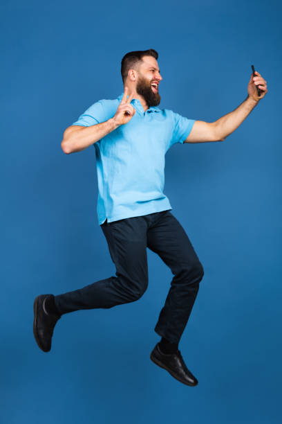 istock Caucasian man's portrait isolated on blue studio background with copyspace 1307723061