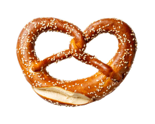 istock Soft pretzel with sesame seeds isolated on white background. 1307724716