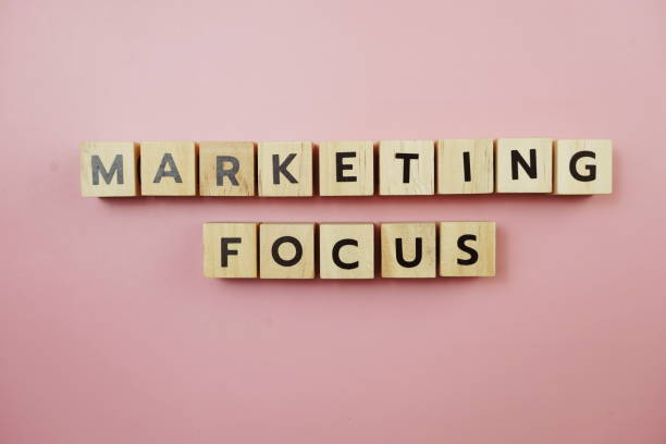istock Marketing Focus alphabet letter on pink background 1307724977