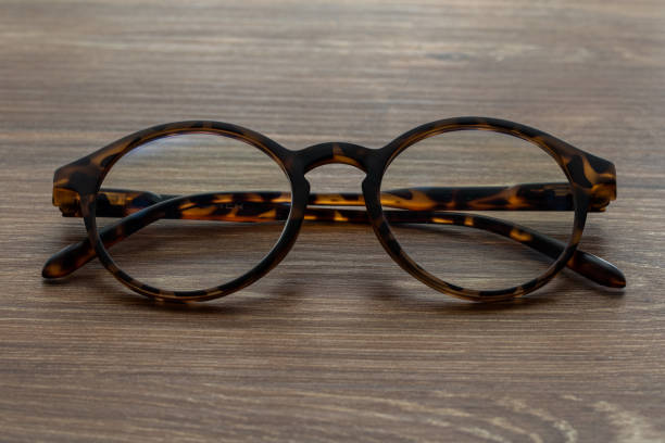istock Eye Glasses on the wooden office table 1307725237