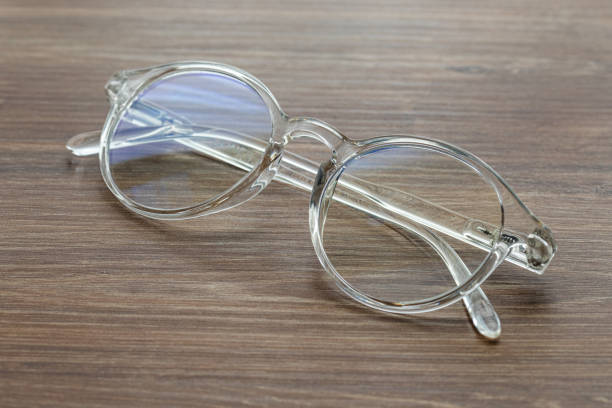 istock Glasses for vision with dioptria on the wooden table office 1307725931