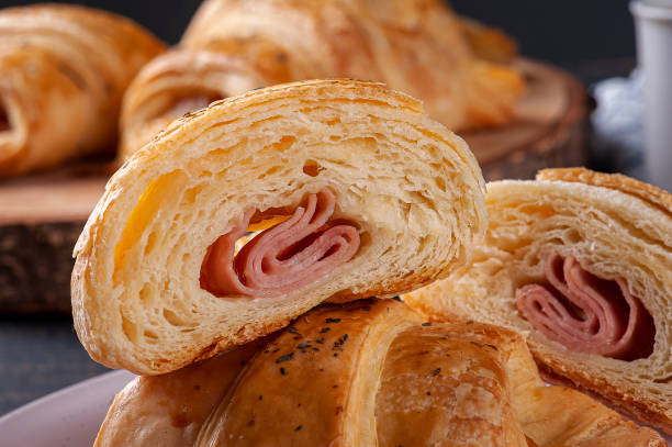 istock Croissant cut in half and stuffed with ham and cheese 1307726485