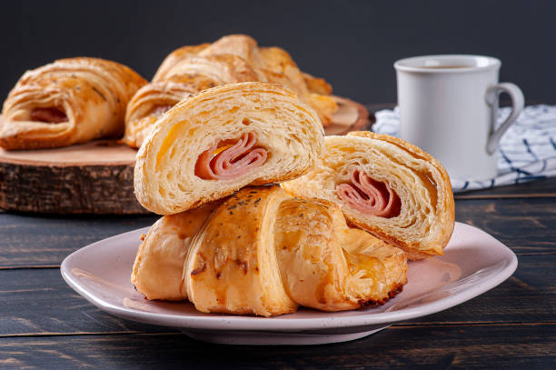 istock Croissant cut in half and stuffed with ham and cheese 1307726497