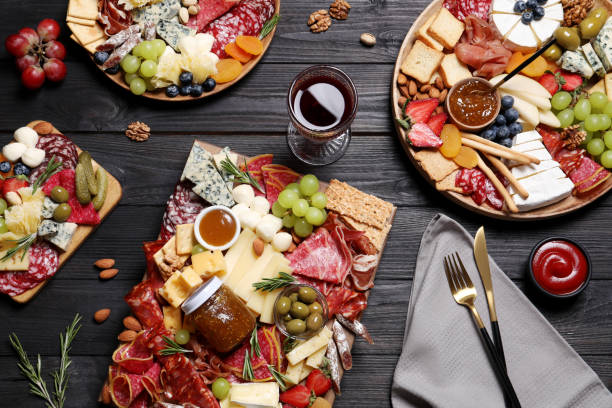 istock Assorted appetizers served on black wooden table, flat lay 1307726541