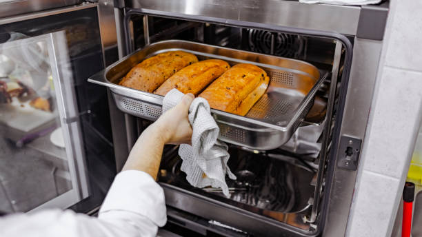 istock Checking on the progress of the bread baking in the oven 1307727162