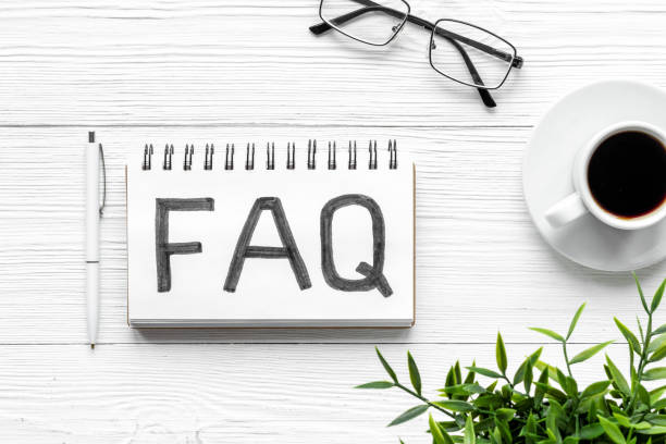 FAQ - fequently asked question - on notebook. Top view stock photo