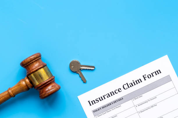 istock Insurance claim form with judge gavel . Top view 1307729561