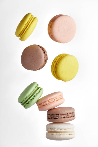 istock Macaroon. Colorful cake macaron with pastel tones fall at the stack macaroon on white background. Top view of almond cookies. 1307730168