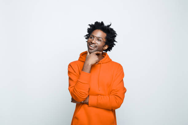 istock Cheerful man in orange hoodie 1307732211