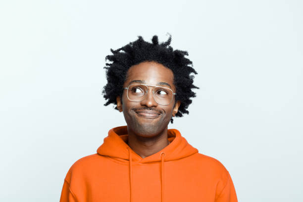 istock Cheerful man in orange hoodie 1307732216