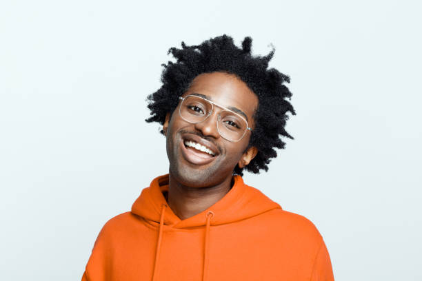 istock Cheerful man in orange hoodie 1307733039