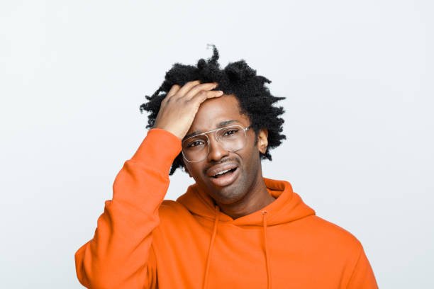 Despaired man in orange hoodie