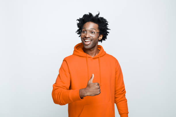 istock Cheerful man in orange hoodie 1307733154