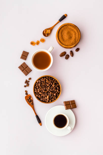 istock Coffee and cocoa beans and ground powder with hot chocolate drink 1307733533