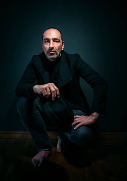 istock Atmospheric dark studio portrait of a middle-aged man 1307733863