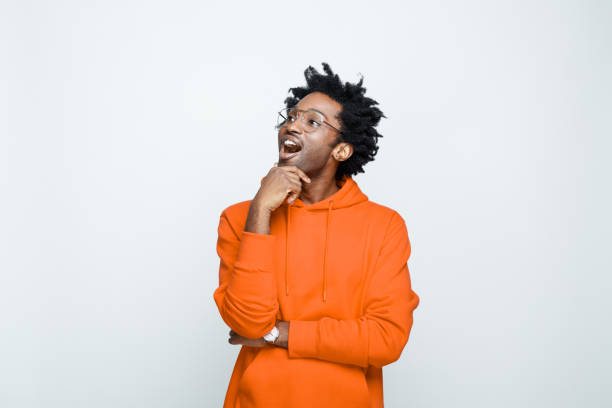 istock Surprised man in orange hoodie 1307734191
