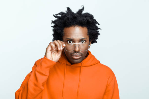 istock Surprised man in orange hoodie 1307734228