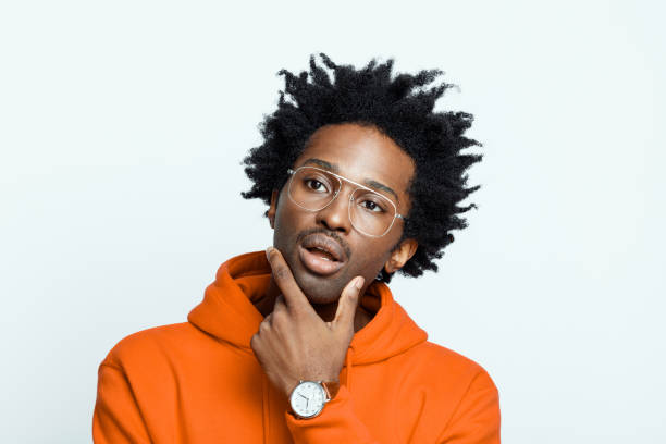 istock Thoughtful man in orange hoodie 1307735269