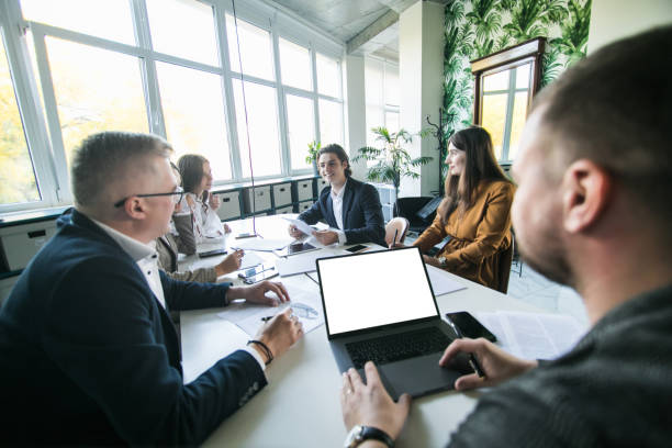 istock Young team working at meeting together to plan and achive goals in office 1307735410