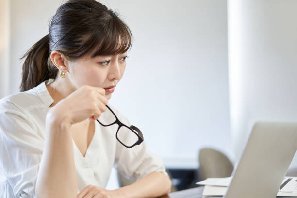 istock Asian woman who feels unpleasant with telework 1307735769