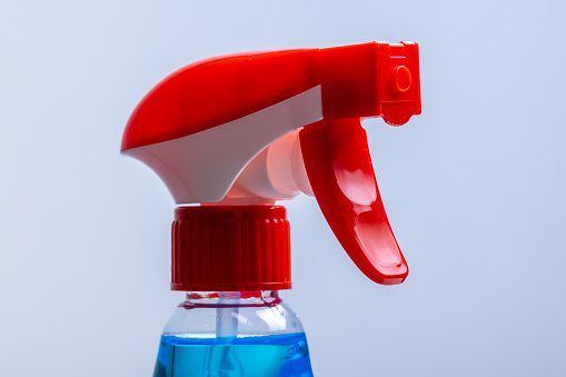 Close up of the upper part of a spray bottle
