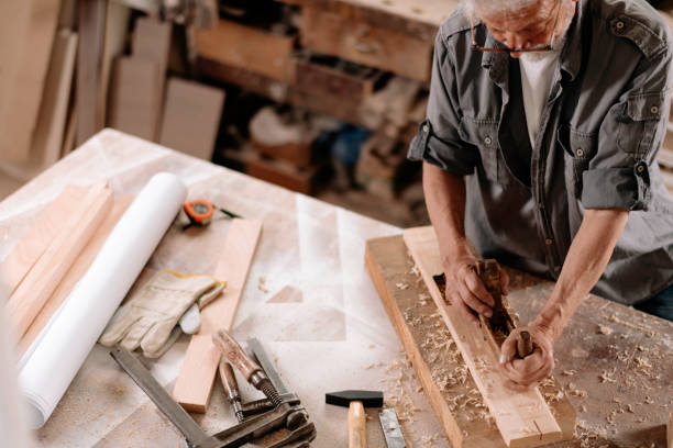 istock Mature carpenter at work stock photo 1307738042