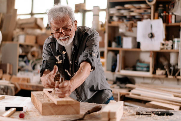 istock Mature carpenter at work stock photo 1307738149