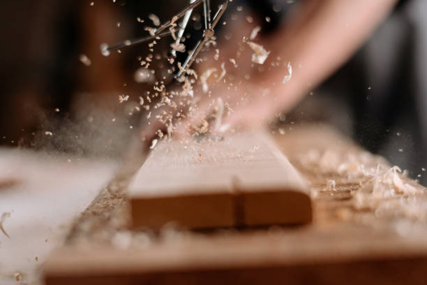 Mature carpenter at work stock photo. Shallow DOF. Developed from RAW; retouched with special care and attention; Small amount of grain added for best final impression. 16 bit Adobe RGB colour profile.