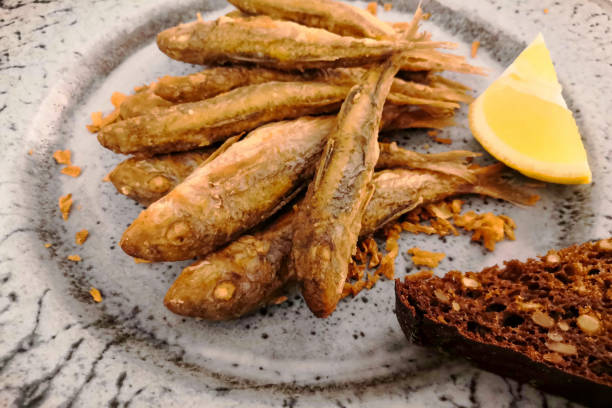 istock Red drum(black sea barabula) fried in a pan (lat.Mullus barbatus), photo on a smartphone, noise 1307739387