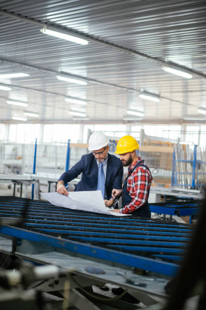 istock Quality inspector and manual worker in a factory 1307739887