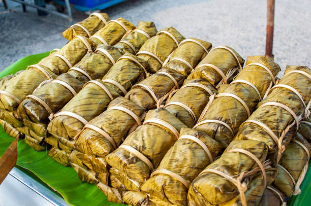 istock Thai desserts wrapped in banana leaves 1307740883