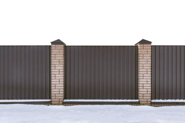 istock Metal fence and snow isolated on white. 1307740944
