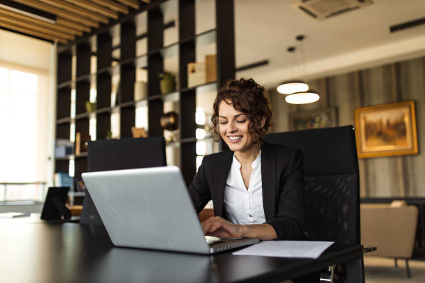 istock Positive manager using laptop in the office, portrait. 1307742696
