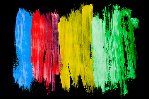 Gouache colorful abstract paint strokes on black background