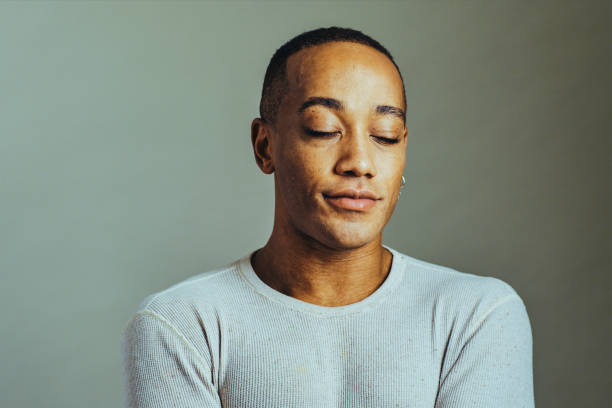 istock Close up studio portrait man with eyes closed 1307745787