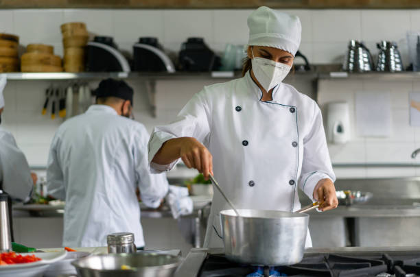 istock Cook wearing a facemask while cooking in the kitchen during the pandemic 1307746935