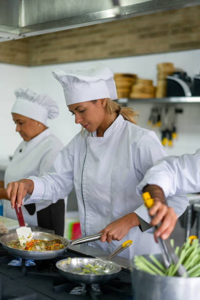istock Chef cooking in a commercial kitchen 1307746978