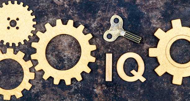 istock Intelligence quotient, iq test score and level concept, gears with key 1307746985