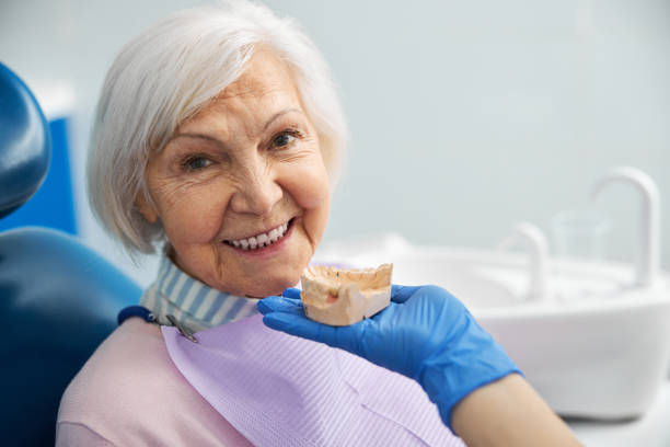 istock Cheerful retiree approving the jaw plaster mold 1307747035