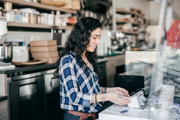 istock Owner of a small shop at work 1307747084