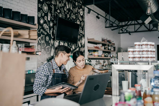 istock Owners working at their small shop 1307747098