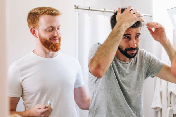 istock Young male couple in morning bathroom routine 1307747328