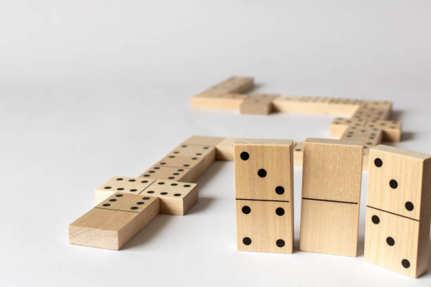 istock A game of dominoes on a light background. Close-up. Selective focus. 1307748300