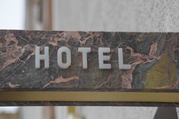 a hotel sign in tourism, overnight stay and guest bed for tourists